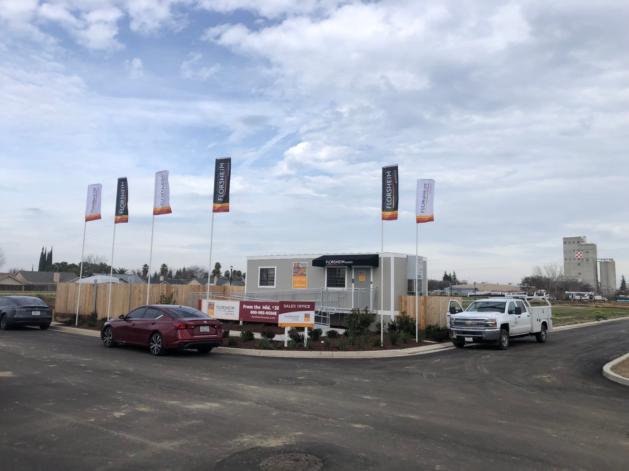 Custom branded commercial flags at a sales office